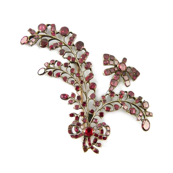 Garnet ribbon tied spray brooch with tremblant insect